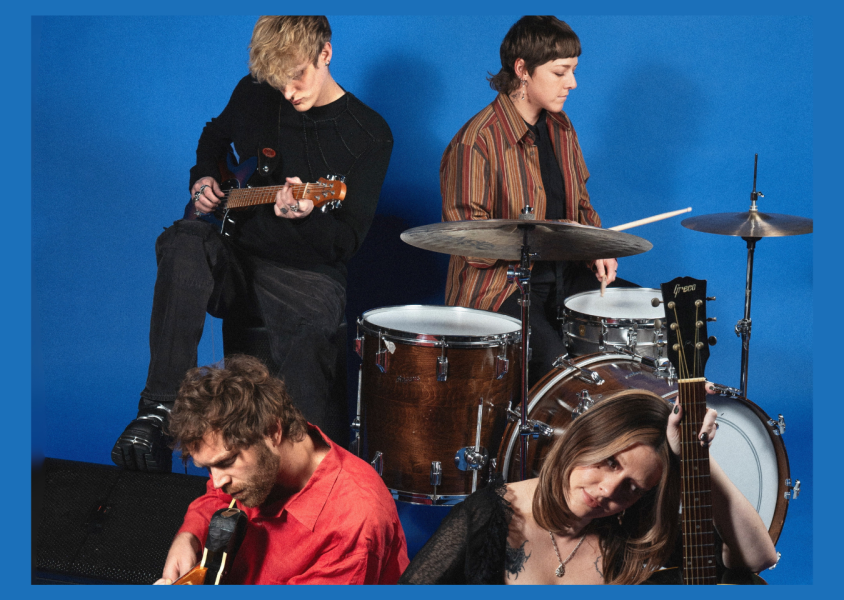 Artist Yumi Zouma performing against blue backgroundx